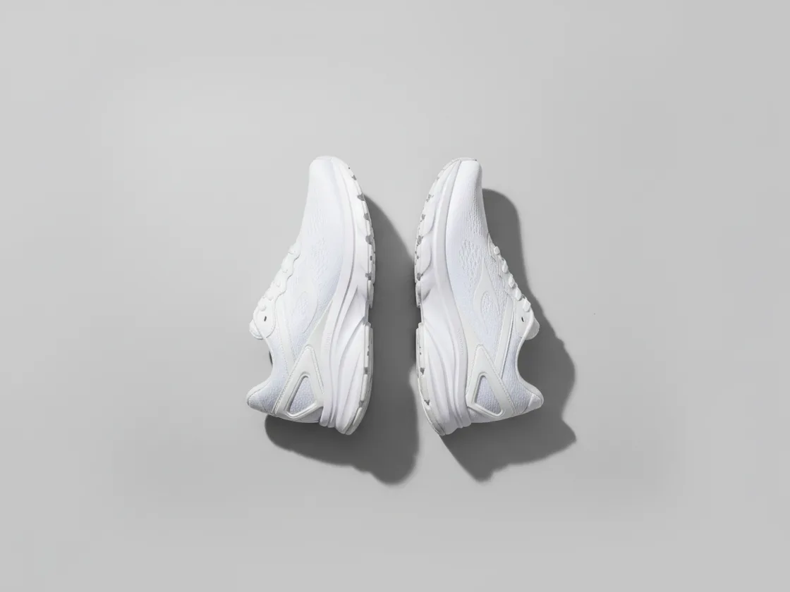The same shoe shown twice side by side as exact left-right mirrors of each other.