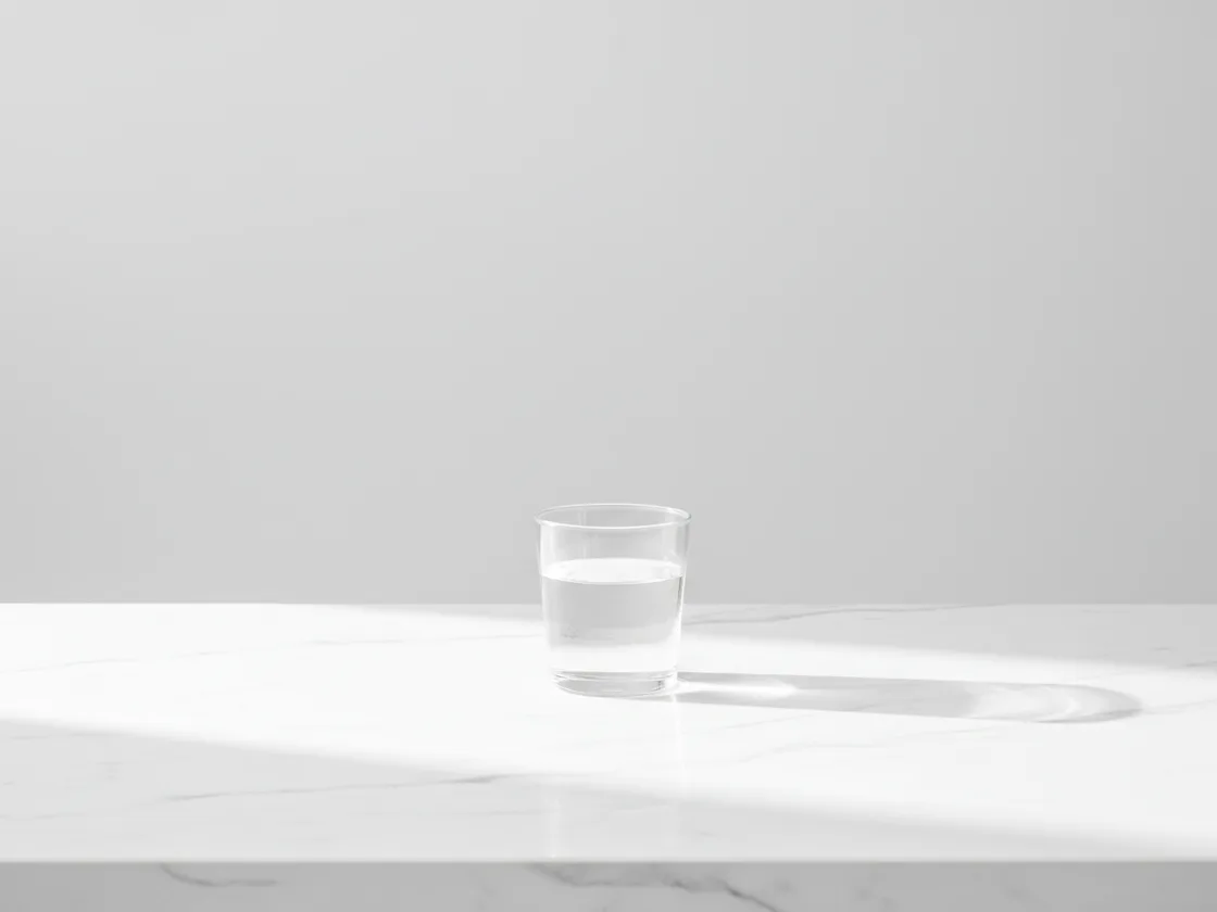 An overexposed photo of a white marble counter with washed-out, blown-out highlights.