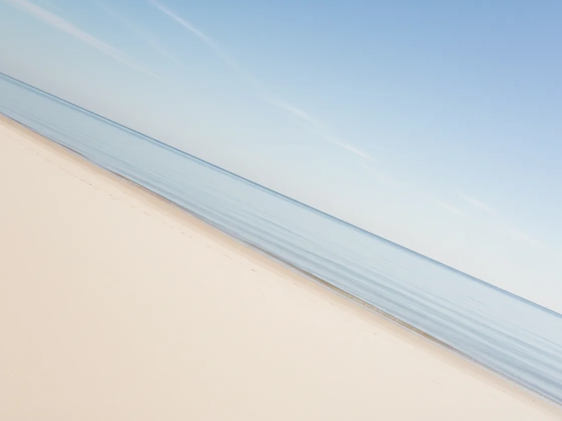 A coastal photo with a visibly tilted horizon line running diagonally across the frame.