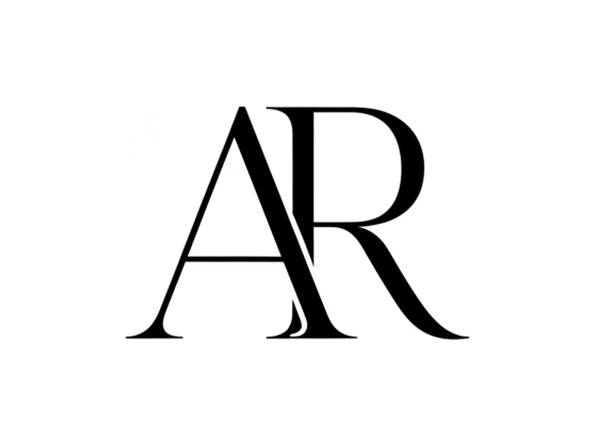 An elegant interlocking serif monogram in black on white, with fine hairline serifs and thick-thin stroke contrast