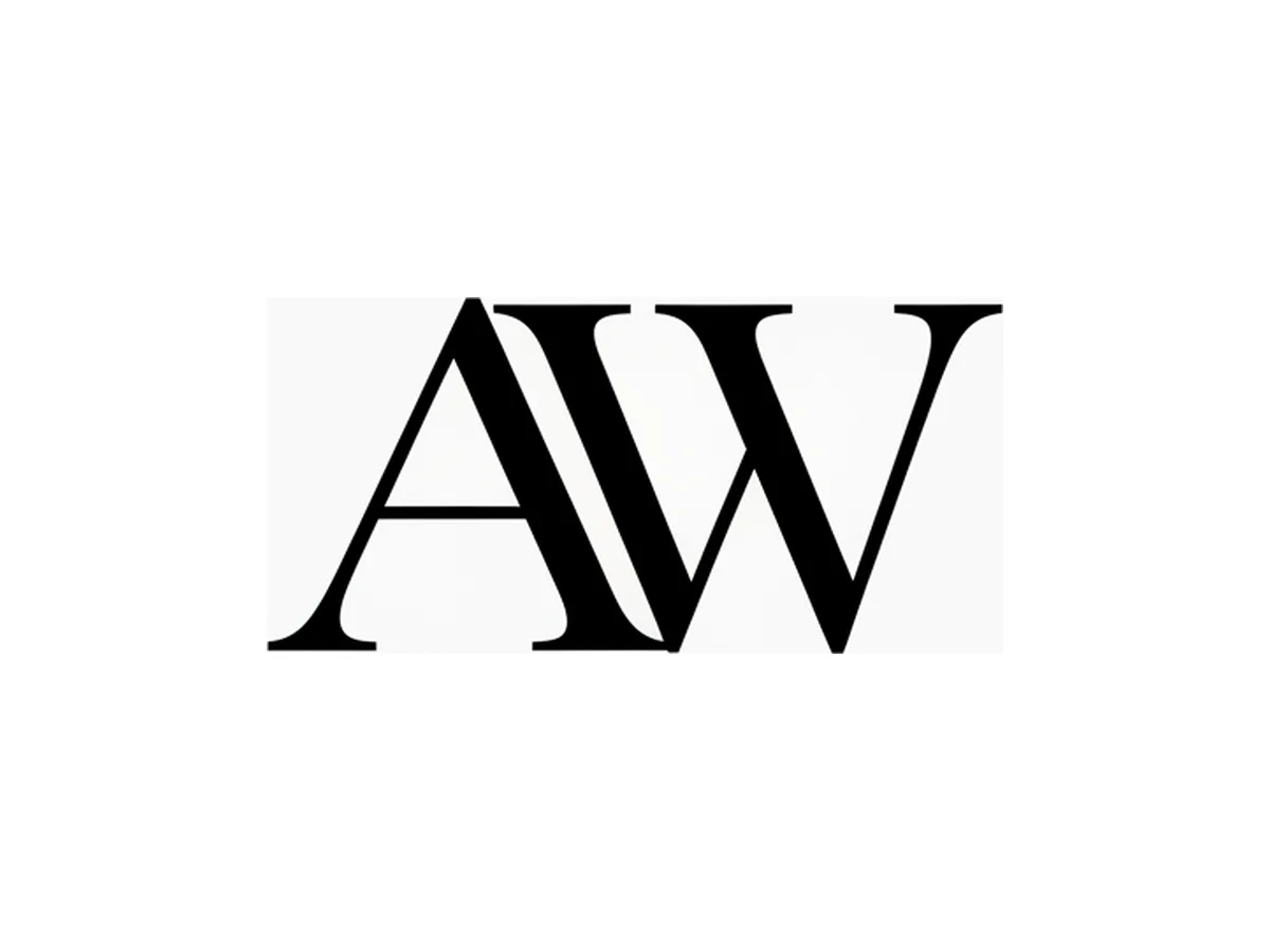 A black serif monogram magnified to show the smooth vector curves and razor-crisp edges an SVG keeps at any size