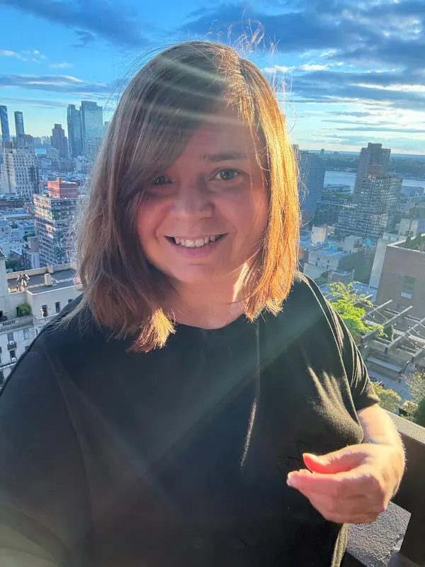 Female version portrait with city skyline — image 1