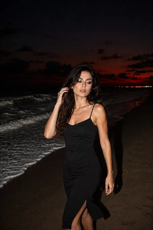 Woman on Beach at Dusk — image 1