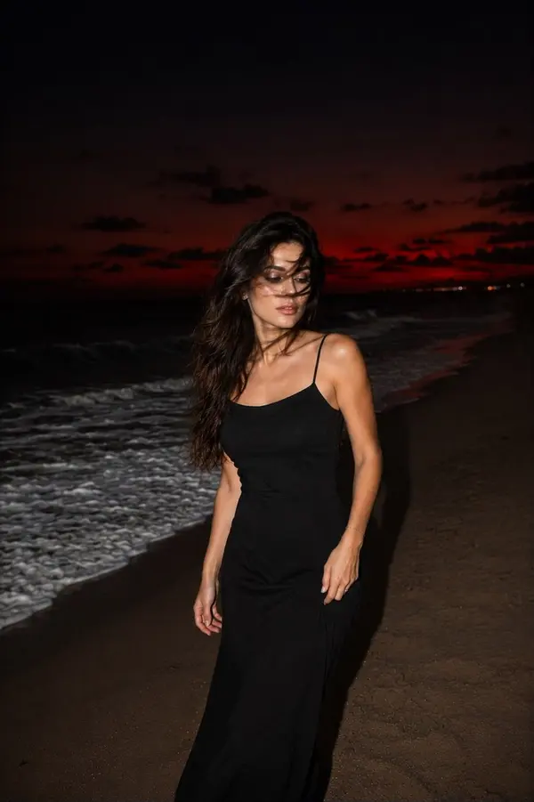 Woman on Beach at Dusk — image 3