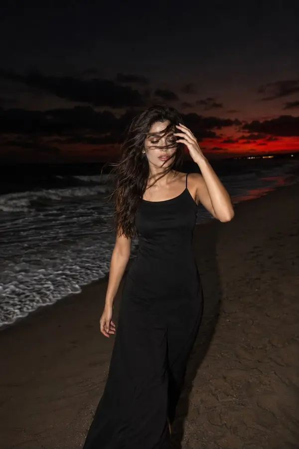 Woman on Beach at Dusk — image 4