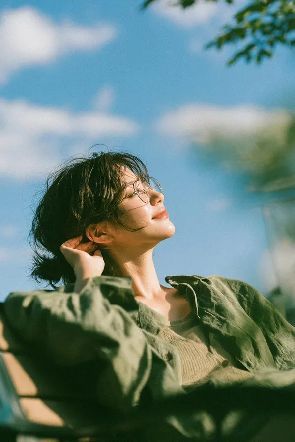 Woman Relaxing in Garden at Golden Hour — image 1