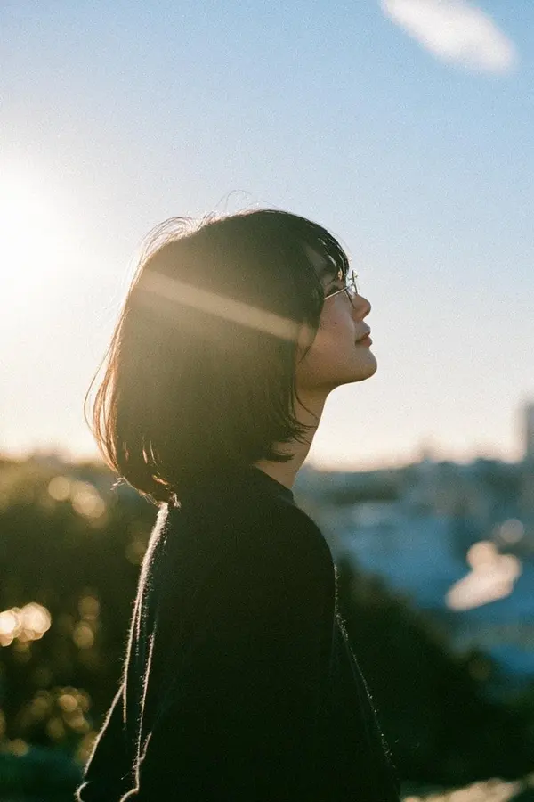Woman Relaxing in Garden at Golden Hour — image 4